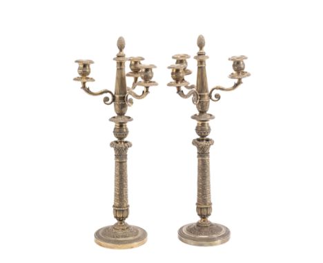 A PAIR OF SILVERED THREE-LIGHT CANDELABRA, PROBABLY FRENCH MID 19TH CENTURY circular bases, slightly tapering stems and urn s