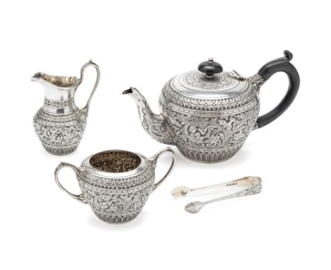 A VICTORIAN SILVER BACHELOR'S THREE-PIECE TEA SET WITH TONGS, WILLIAM HUTTON &amp; SONS OF SHEFFIELD, LONDON, 1886 chased all