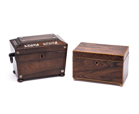 A VICTORIAN ROSEWOOD AND MOTHER-OF-PEARL INLAID TEA CADDY, MID 19TH CENTURY sarcophagus form with drop-ring handles, inlaid t