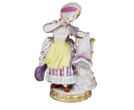 A MEISSEN FIGURE OF A GIRL, 19TH / 20TH CENTURY modelled standing in 18th century costume about to fire an arrow, her left ar