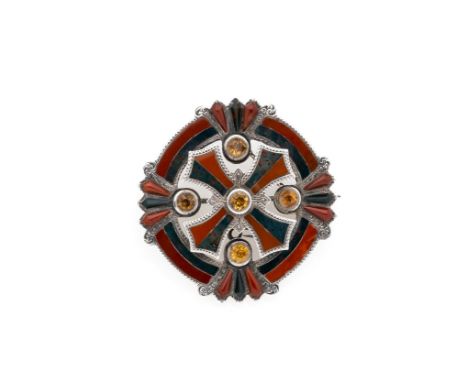 ‡ A VICTORIAN SCOTTISH PEBBLE BROOCH, 1871 of circular design set with jasper and bloodstones accented with circular cairngor