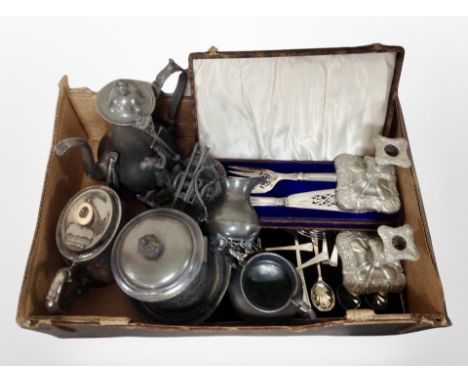 A box of 19th century pewter tea wares, pair of silver-plated candlesticks, cased fish knife and fork in velvet-lined case, o