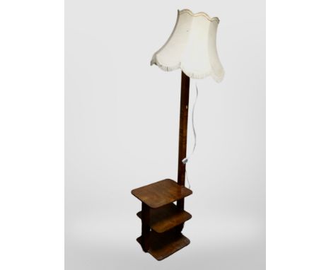 An Art Deco burr walnut veneered standard lamp book table 