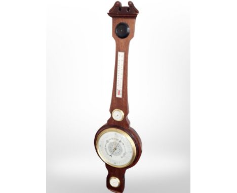 A reproduction barometer with silvered dial.