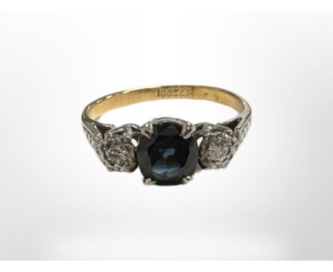 An 18ct yellow gold sapphire and two stone diamond ring, size J/K. CONDITION REPORT: 2.7g.