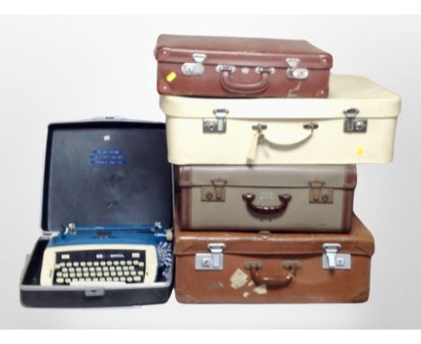 Four vintage luggage cases and a Safari typewriter in box.