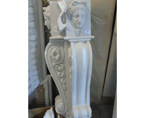 A Substantial Fire Surround with classical face mask, scrolled corbels, dentil and further detailing, 22cm wide approximately