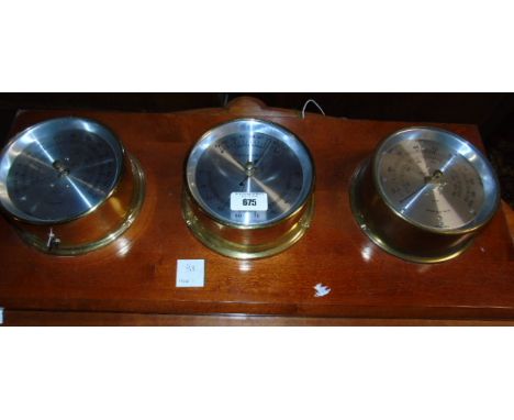 A Brass Mounted Nautical Themed Board with Cased Compass, Speedometer, Temperature and other Gauges.