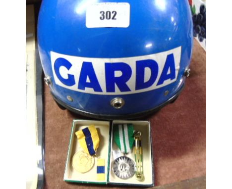 Garda Siochana Service Medals & Motorcycle Helmet: Two Service Medals issued to members of An Garda Siochana. The Jubilee Med