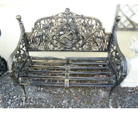 A Cast Iron Garden Bench with plaque depicting a reclining lady to the back. €300-400