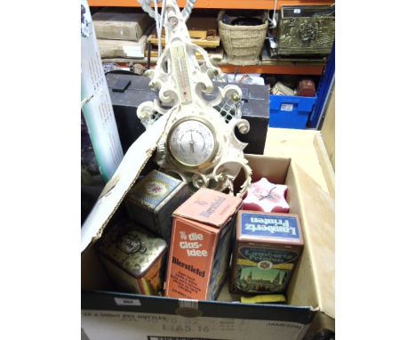 A Barometer/Hydrometer, together with vintage tins and a candle.