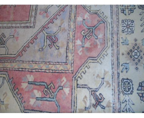 A Large Turkish Carpet of Geometric Design, within a multiple border, 460cm x 307.5cm  €250-350