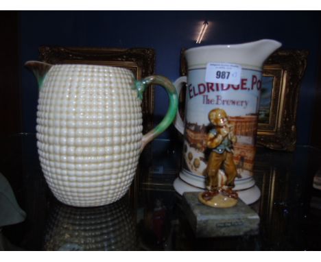 A Burslem for Wilkinson 'Corn' Jug,  a Wade Figurine of 'Phil the Fluter' on a Marble Base and a Prompots Jug, (3). €40-60