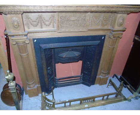 A Carved Pine Fire Surround In Adams Style, 5ft 7in. wide & 4ft 5in. in height, together with cast iron fire inset €200-300