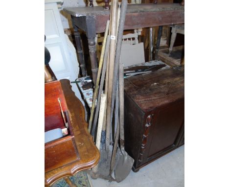 A Collection of Tools to include a pickaxe, shovels, hoe, fork etc.