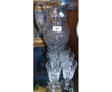 A Crystal Jug on a Circular Pedestal Base and Six Matching Glasses. €40-60