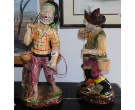 Two Large Ceramic Figures possibility Capodimonte, both depicting fisherman and their catch. The largest 19.5ins in height ap