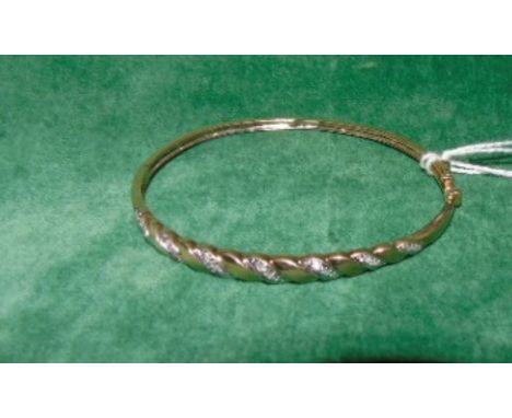 A Gold & Diamond 9ct Bangle. €120-150
