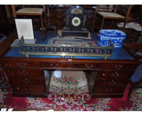 A Large Pedestal Office Desk with a blue leather inset top , three frieze drawers and each pedestal with three further drawer