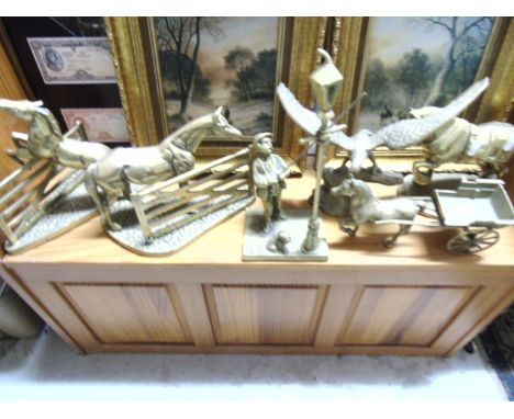 A Collection of Brass to include Two Heavy Bookends Depicting Horses at Gates, A Victorian Lamp Lighter, An Eagle and Two Fur