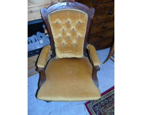 A Victorian Mahogany Button-Back Armchair, standing on turned front legs & castors, the chair upholstered in gold. €80-120