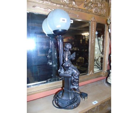 A Bronzed Figural Lamp of a Girl Reading A Book (1). €30-50