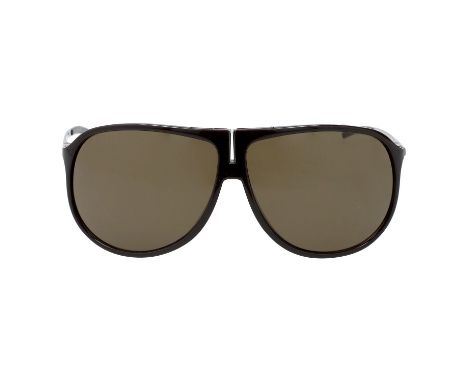 DIOR HOMME Sonnenbrille "0082/S". Braunes Modell mit silberfarbenen Details, getönten Gläsern. Box anbei. Tragespuren vorhand