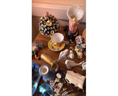Mixed lot of porcelain and ceramic figurines, floral arrangements, and decorative items. Includes a blue serving set with bir