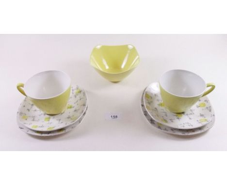 A Jessie Tait yellow 1950's Midwinter tea set comprising eleven cups and twelves saucer, sugar and twelve tea plates