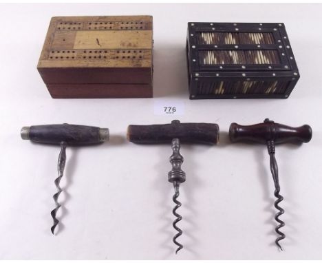 A porcupine quill box, three corkscrews and a cribbage board 
