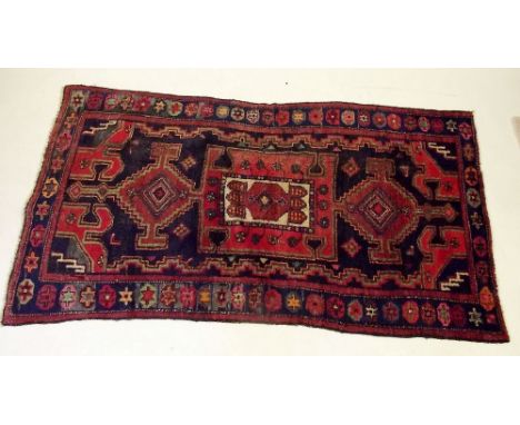A Persian Hamadan rug on a blue ground 200 x 106cm