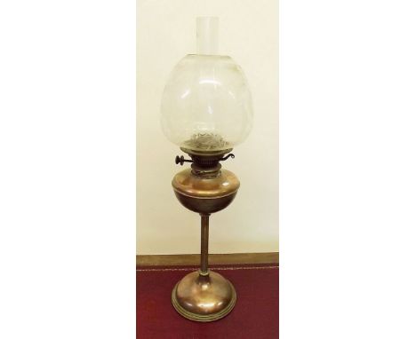 A Victorian brass and copper oil lamp with etched shade