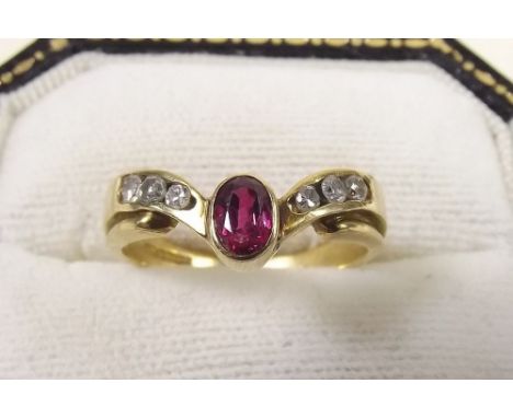 An 18 carat gold ruby and diamond ring