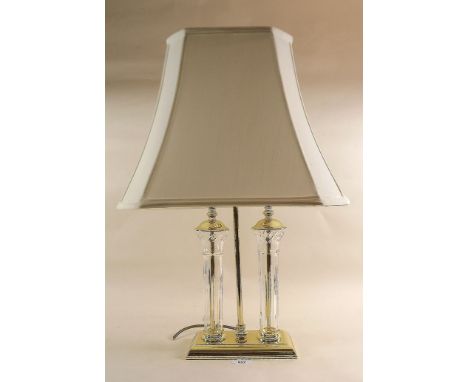 A brass and glass twin light table lamp 