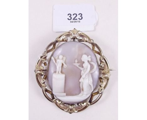 A Victorian cameo brooch carved woman and cherub in pinchbeck surround