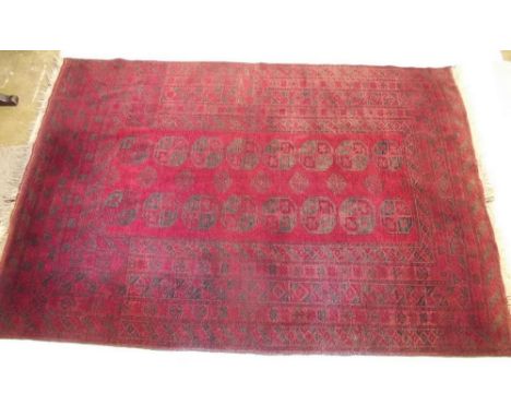 A red Persian style geometric rug - 5.5 x 8ft approx