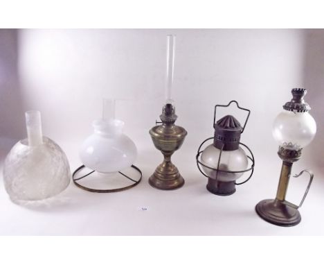 A Victorian oil lamp shade, three various small oil lamps etc.
