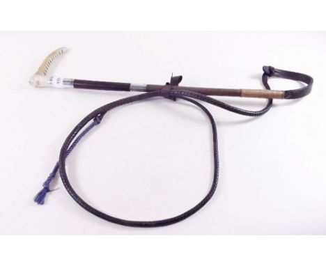 An early 20th century silver mounted hunting crop with horn hilt and leather thong - inscribed for 1925