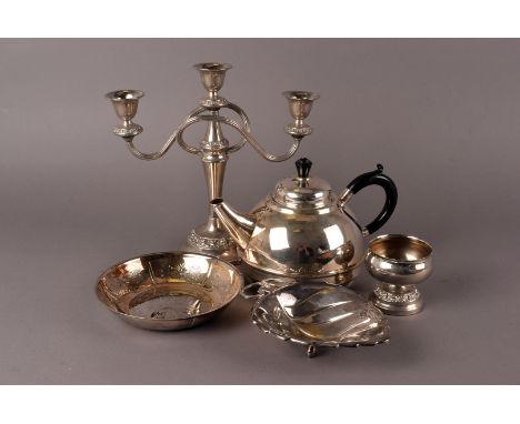 A large collection og silver plated items, including a three branch candle stick, tea pots, a goblet, various dishes and more