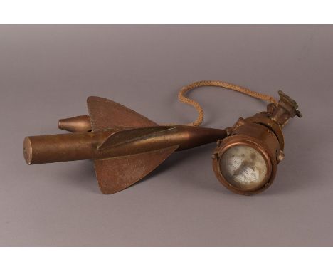 A Walker's Cherub Mark II Ship Log, in brass houseing, together with two arrow or dart shaped log spinners, a log wheel on ro