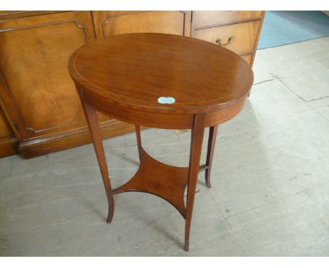 A mahogany oval occasional table, with splayed square tapering legs, and shelf stretcher 52 cm H 