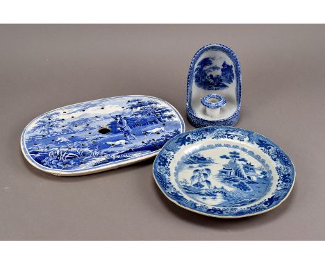 A group of early 19th century and later blue and white pottery, including a rare 'Gamekeeper' pattern drainer c.1825, and an 