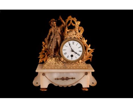 A late 19th century French gilt and alabaster mantle clock, the white alabaster base supporting a drum 30 hour movement and s