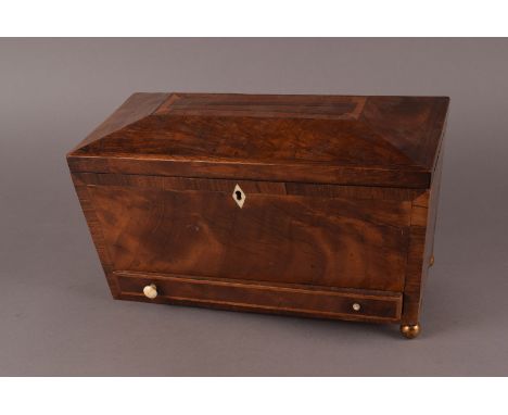 A Victorian mahogany and inlaid sarcophogus shaped tea caddy, the inner with three compartments, having drawer to lower, ivor