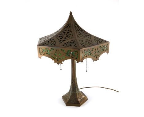 An American stained glass table lamp, circa 1920, the hexagonal section Oriental pagoda style domed shade reticulated with fo