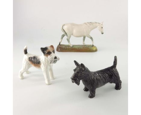 A Royal Doulton figure of a horse, HN2569, together with a Royal Crown Derby figure of a Scottie dog and a Carlton Ware terri