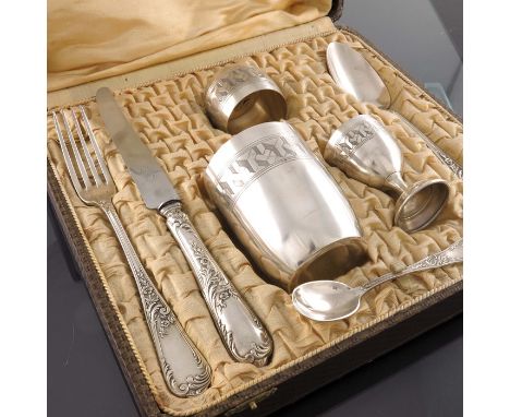 A French silver plated christening set, Ravinet and Cie, circa 1900, including egg cup, beaker, napkin ring, egg spoon, table