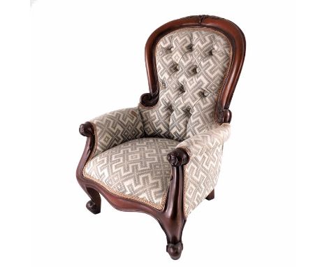 A Victorian style childs armchair, upholstered and carved, button back, 52cm high