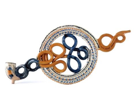 A Staffordshire Prattware coiled and knotted puzzle pipe, 19th century, 31.5cm long