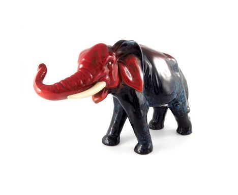 Charles Noke and Fred Allen for Royal Doulton, a large Sung glazed elephant figure, modelled with trunk raised, painted marks